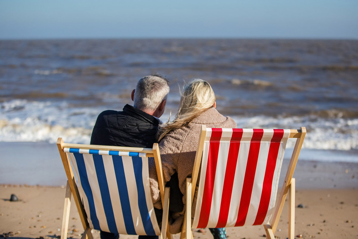 Couple on deckchairs on the beach at Suffolk.jpg