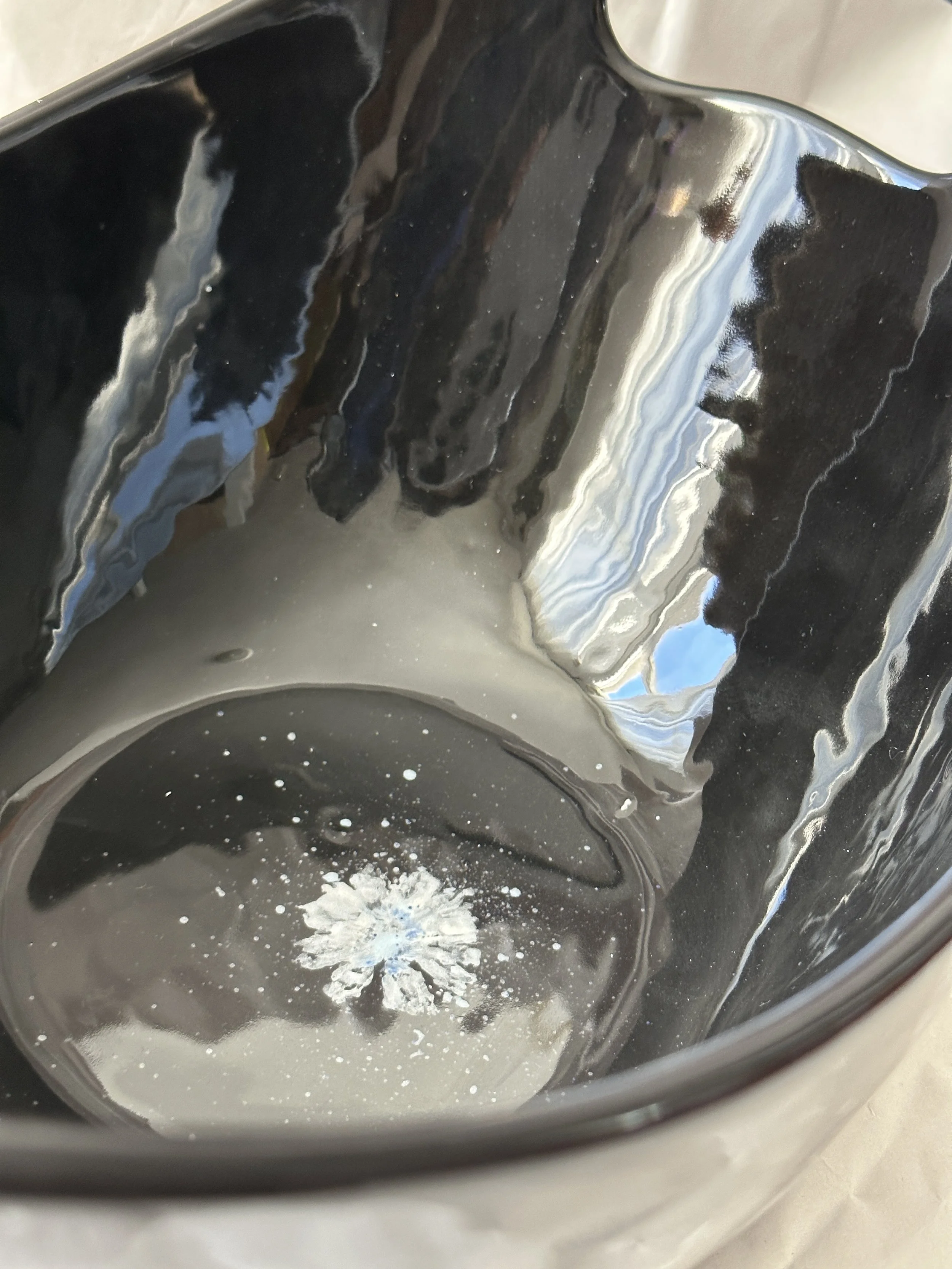  Boat shape bowl with handles 11” x 7.25” x 5.5” Daisy imprints in white, off white and a touch of blue on black ground.Food safe, dishwasher safe, but best to hand wash. 