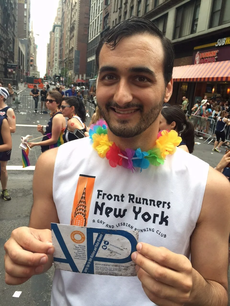 Me at NYC Pride 2015, holding one of the weathered cards that I had designed for AVP.