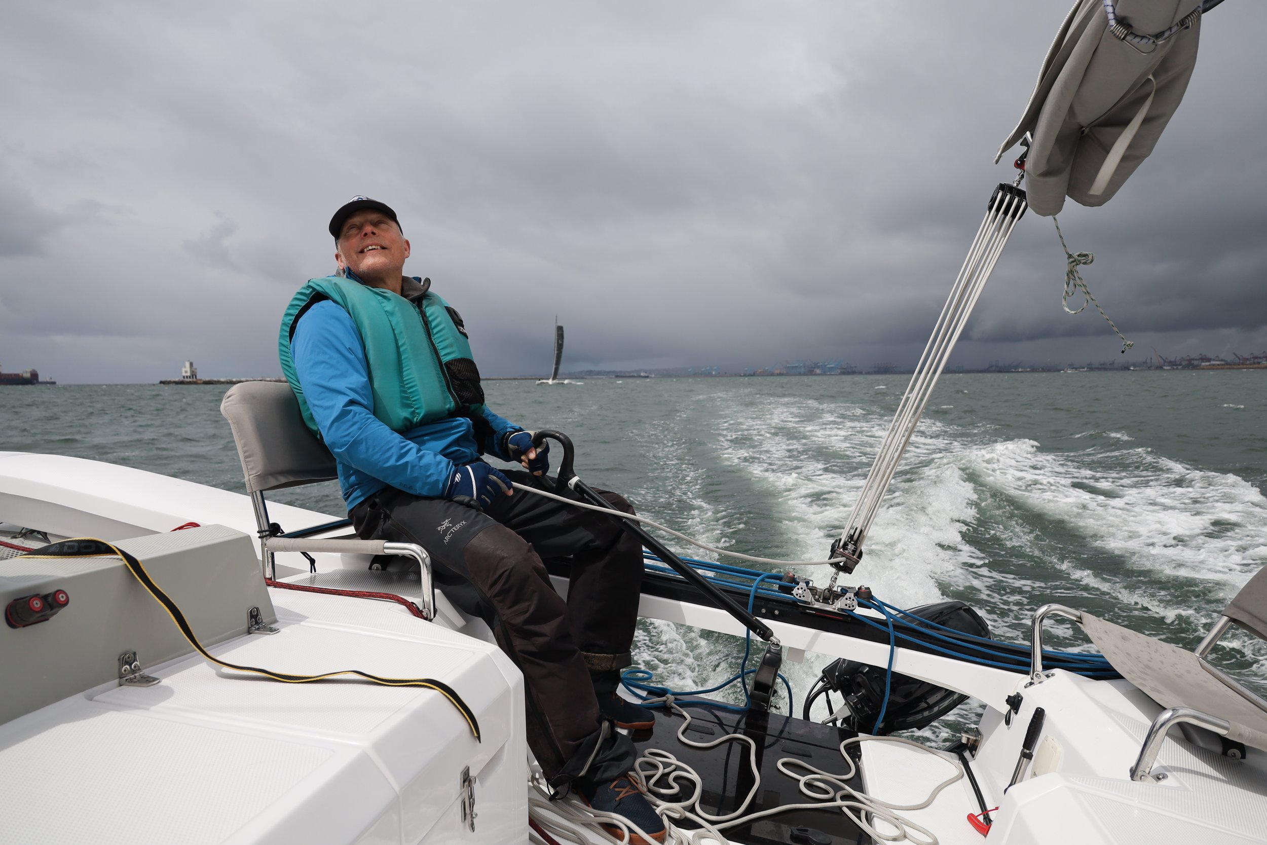 Jim at helm in wind.jpeg