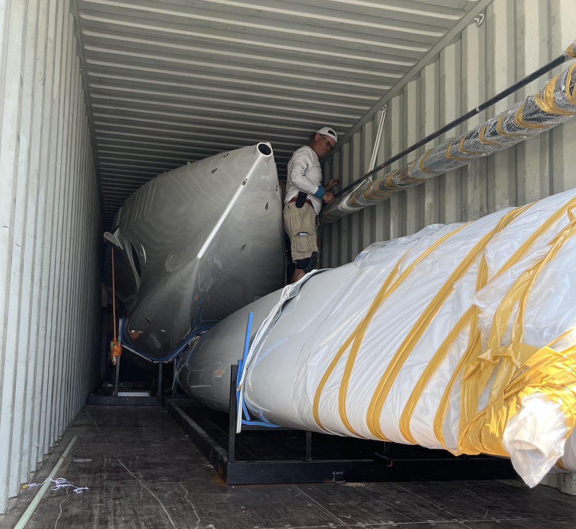 Corsair trimaran being off loaded