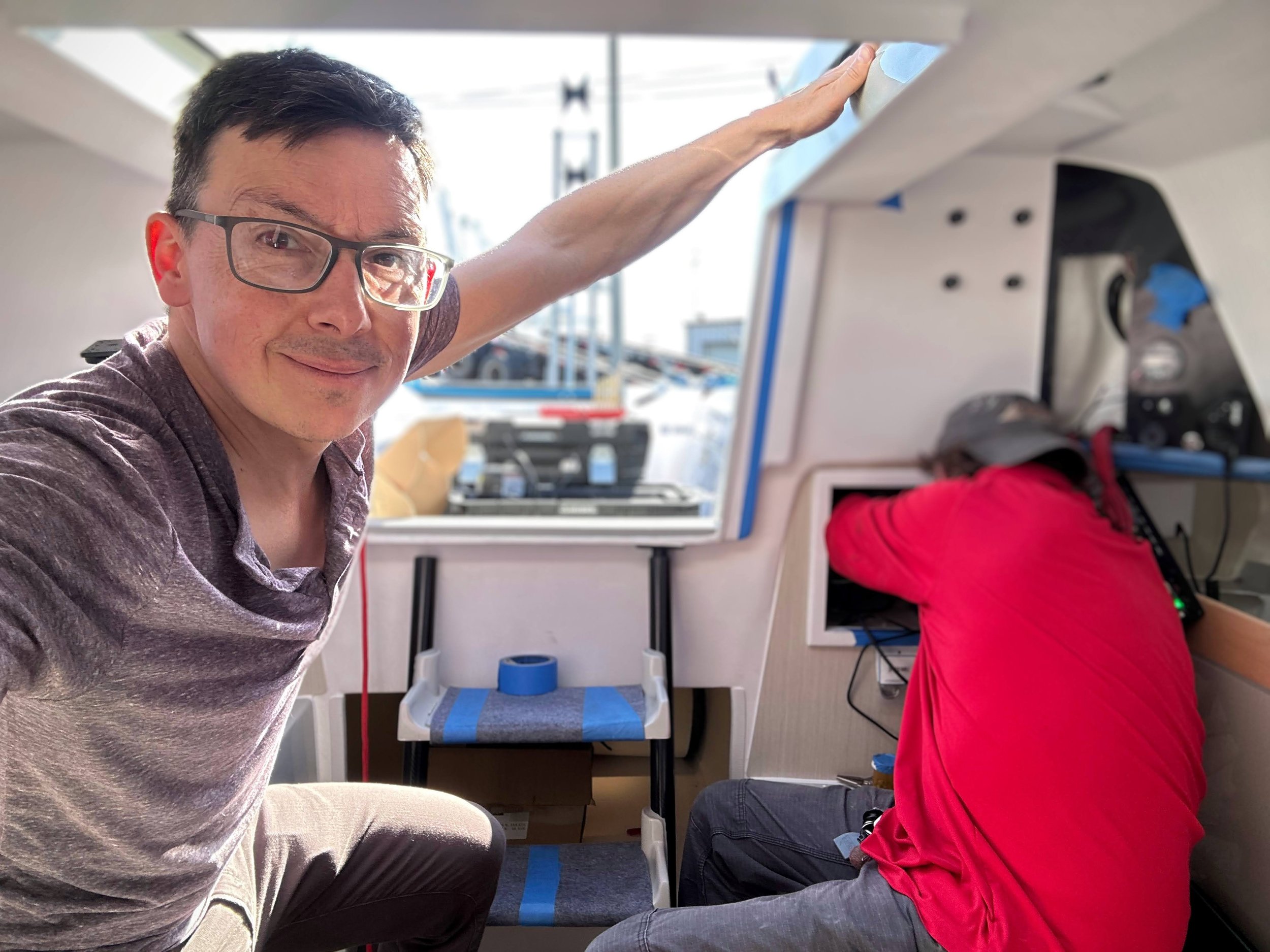 Brian in the boat helping.jpg