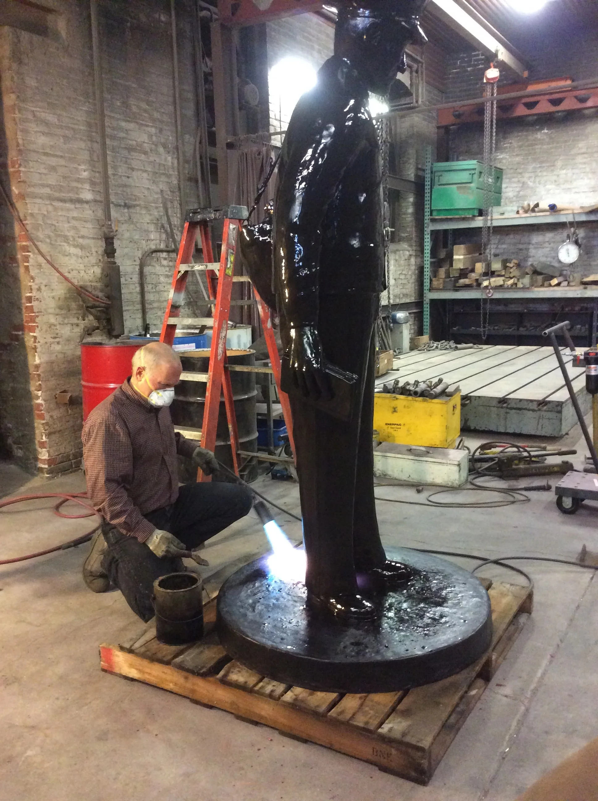 Larry Welker III applying a hot wax finish