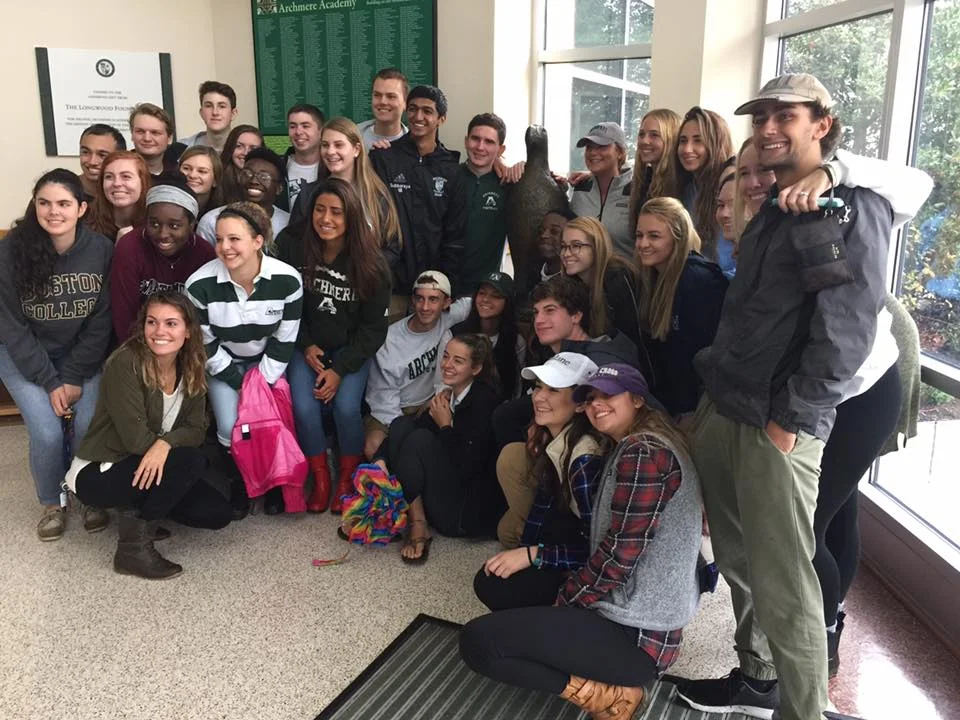 Seniors pose with the new bronze of their beloved mascot. The graduating class came up with the idea and commissioned the bronze.