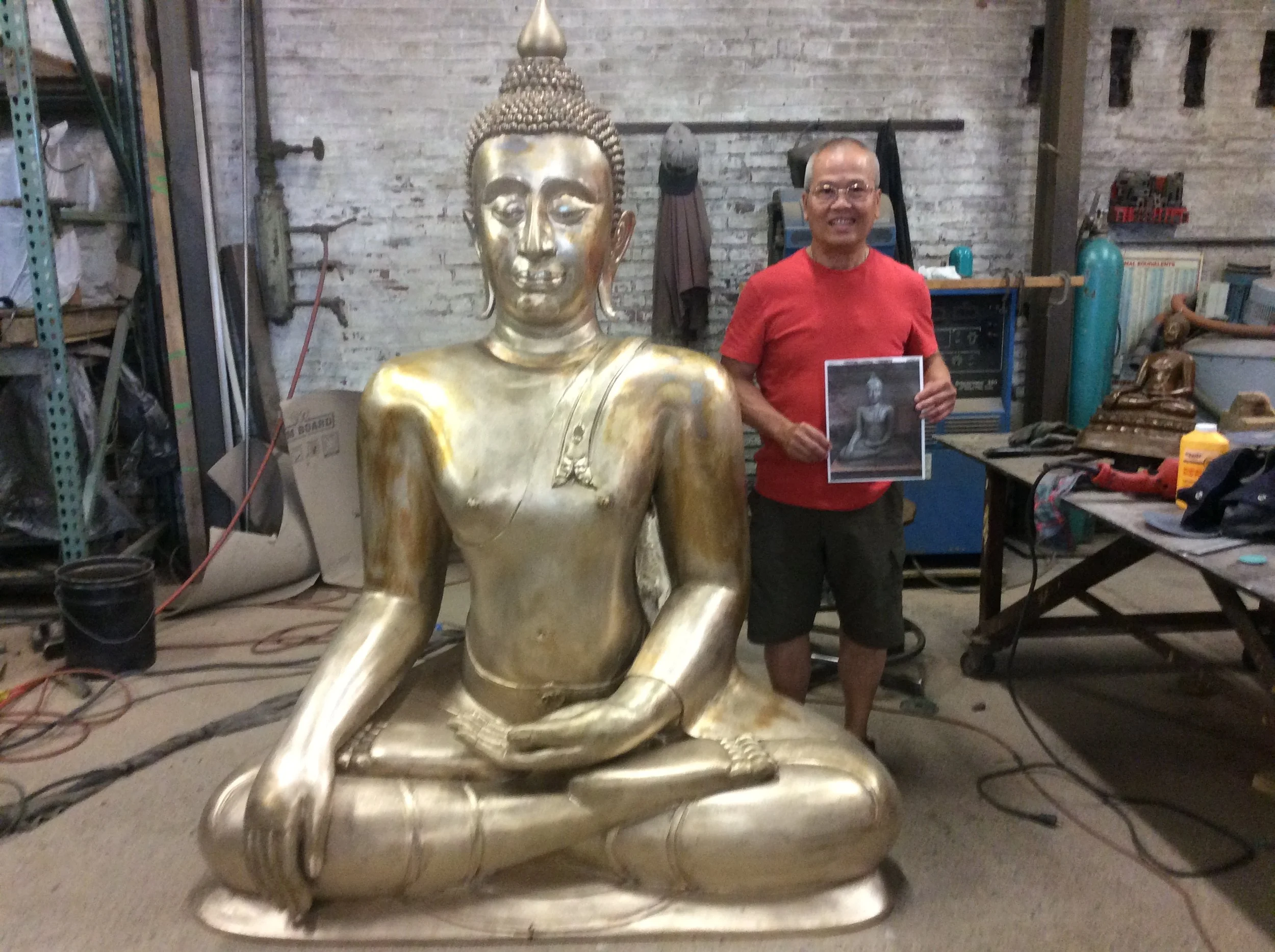 Artist and foundry friend Vivat Hongpong with his seven foot bronze Buddha finished in metal and waiting for patina.