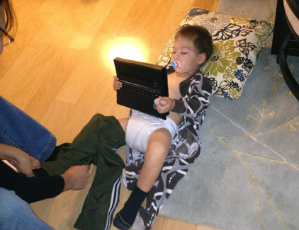 Ben's "blended life"! Plays on a iPad while Mom changes his diaper.