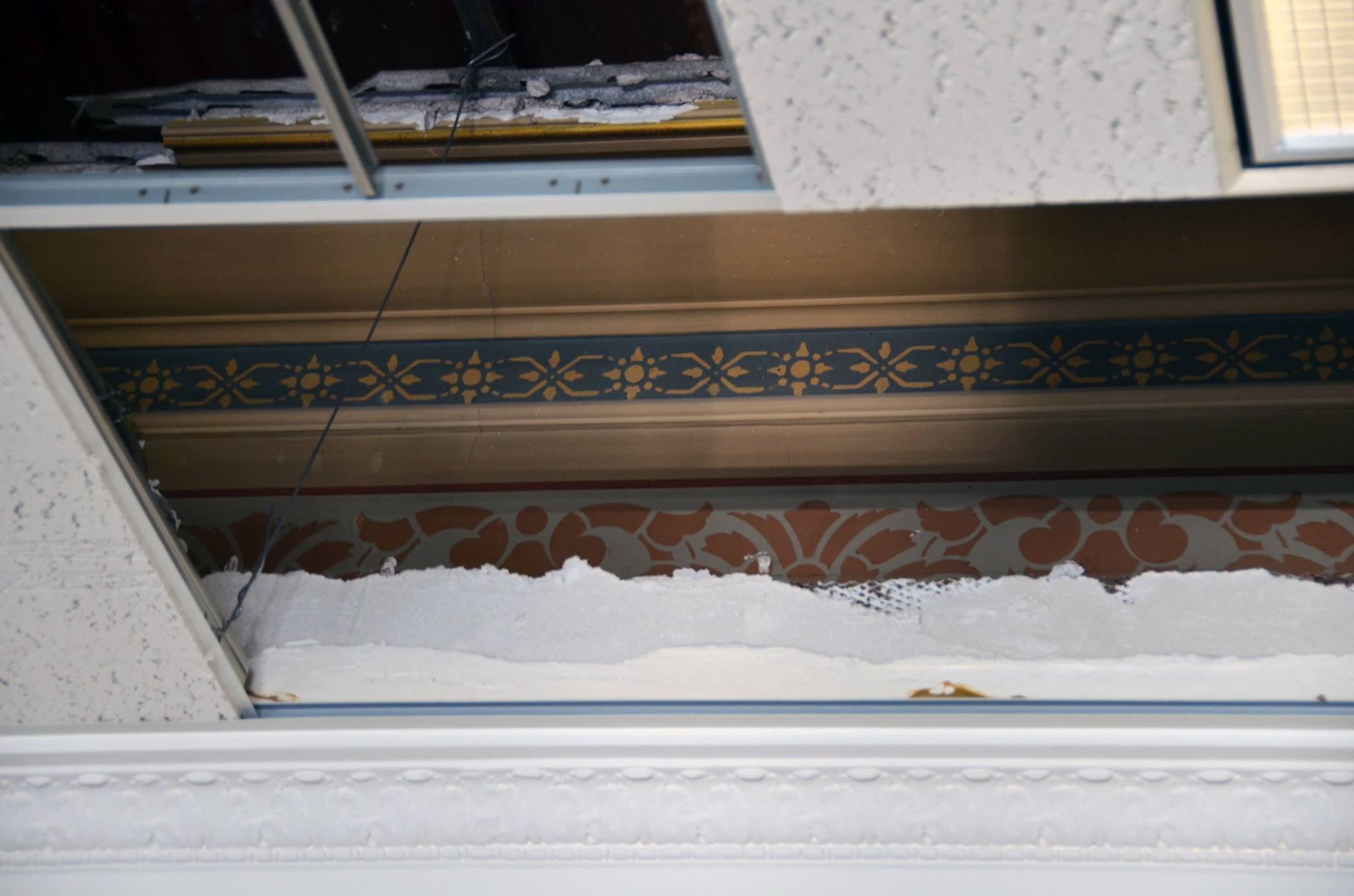 Historic Decorative Elements Hidden  Above Suspended Ceiling Tiles