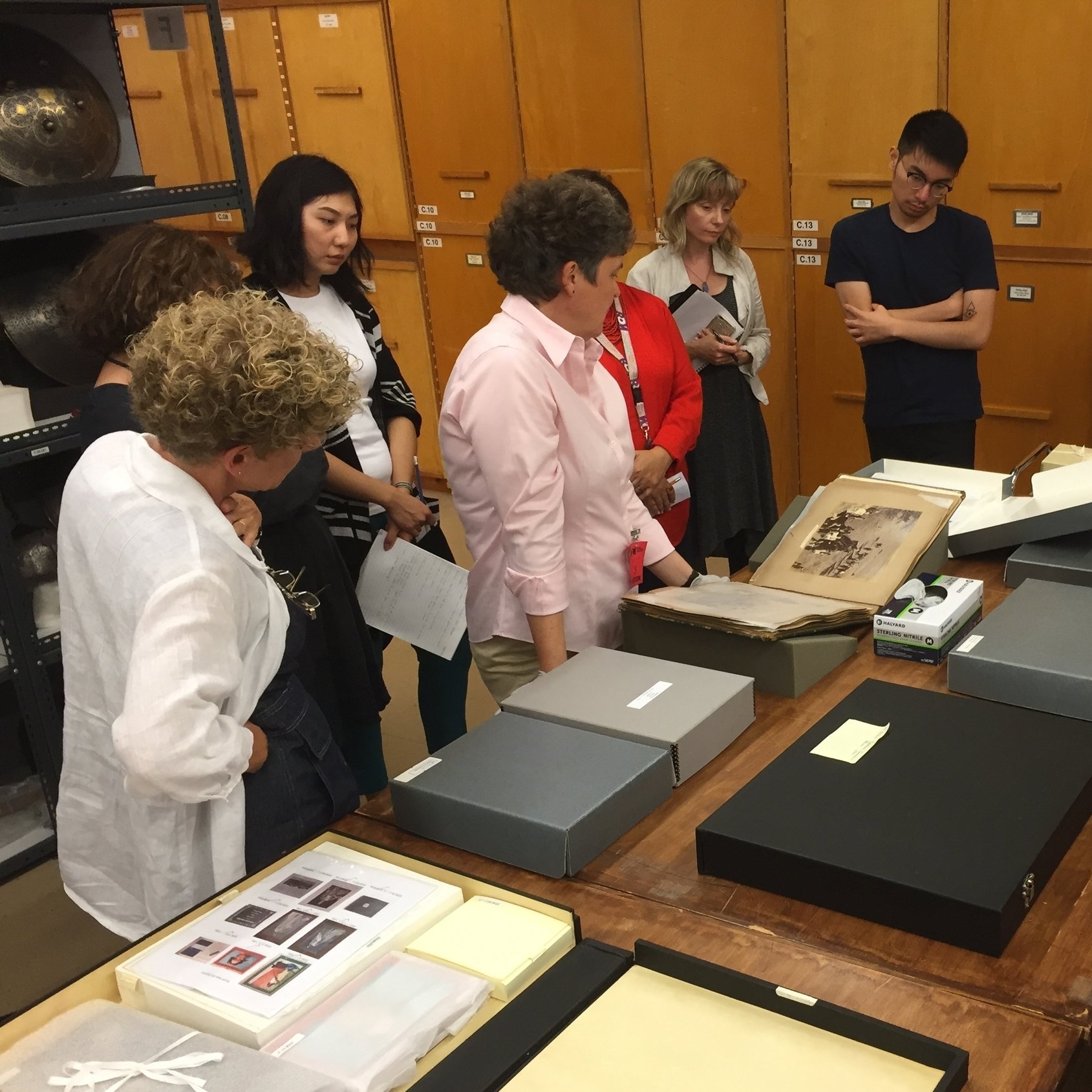 Ms. Fischer examines the album of the visit of the Duke of Connaught to Hyderabad from the ROM collection. (Photo: Celio Barreto, 13 Sept. 2016)