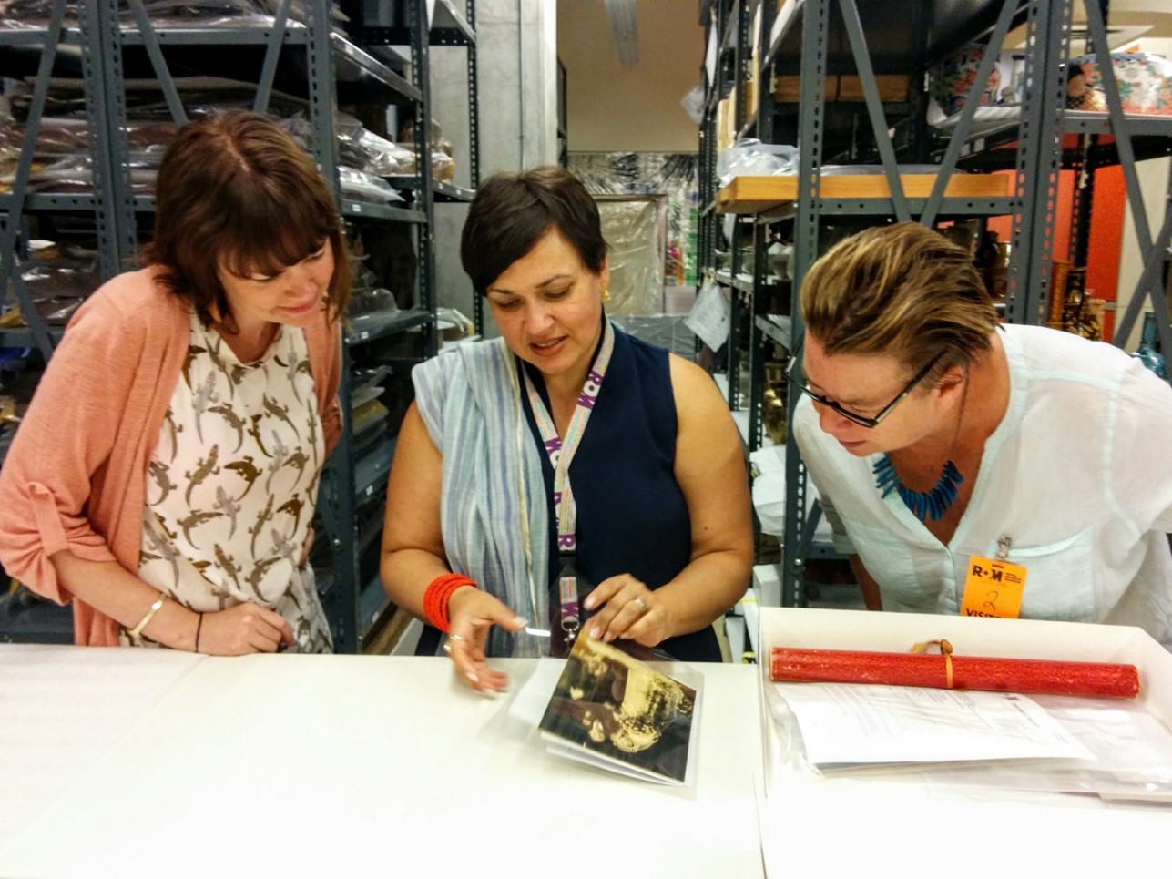 FamCam collaborators examining the collection at the ROM (J. Orpana, 2016)