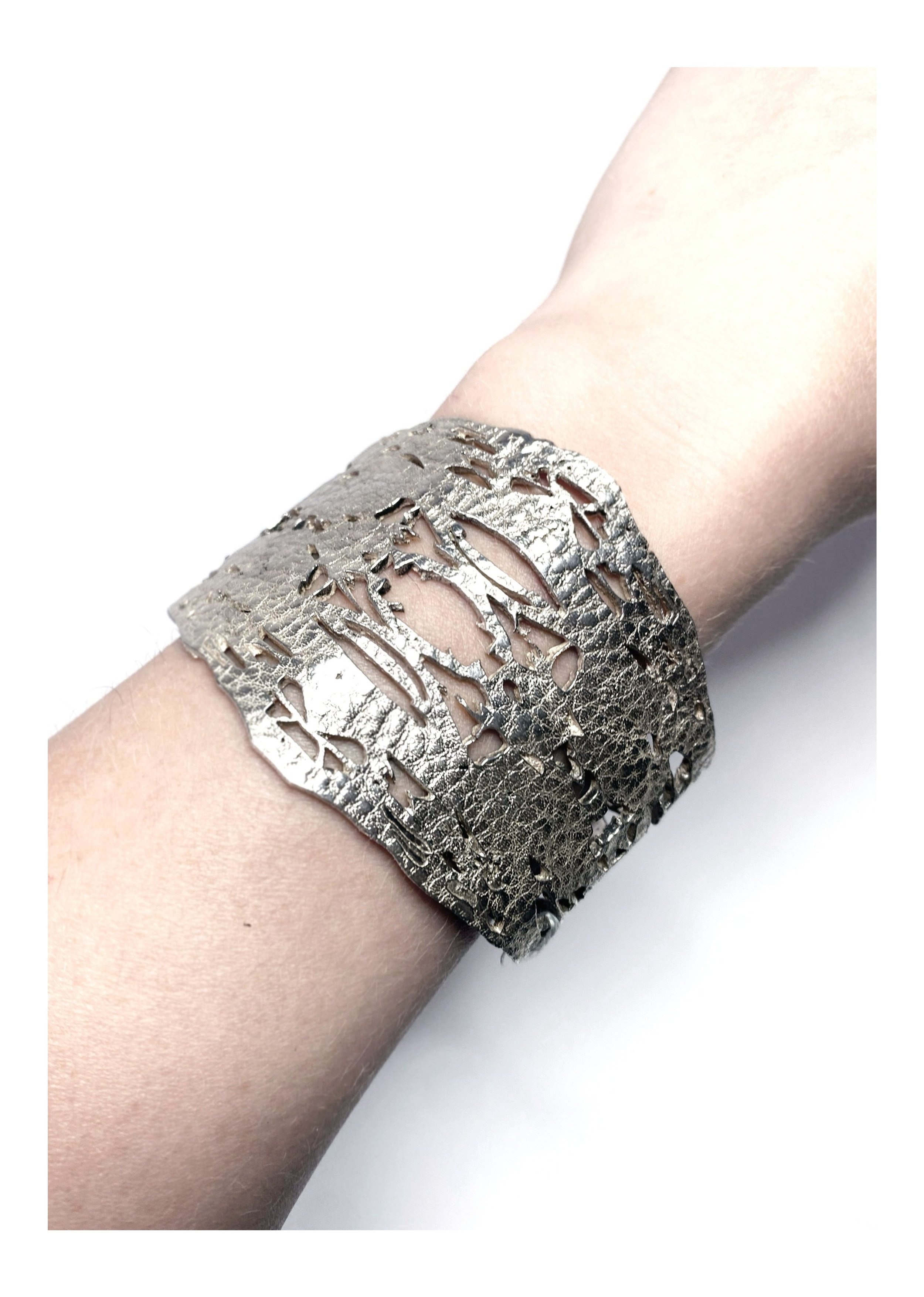 leather%252Bcuff%252Bbeing%252Bworn.jpg