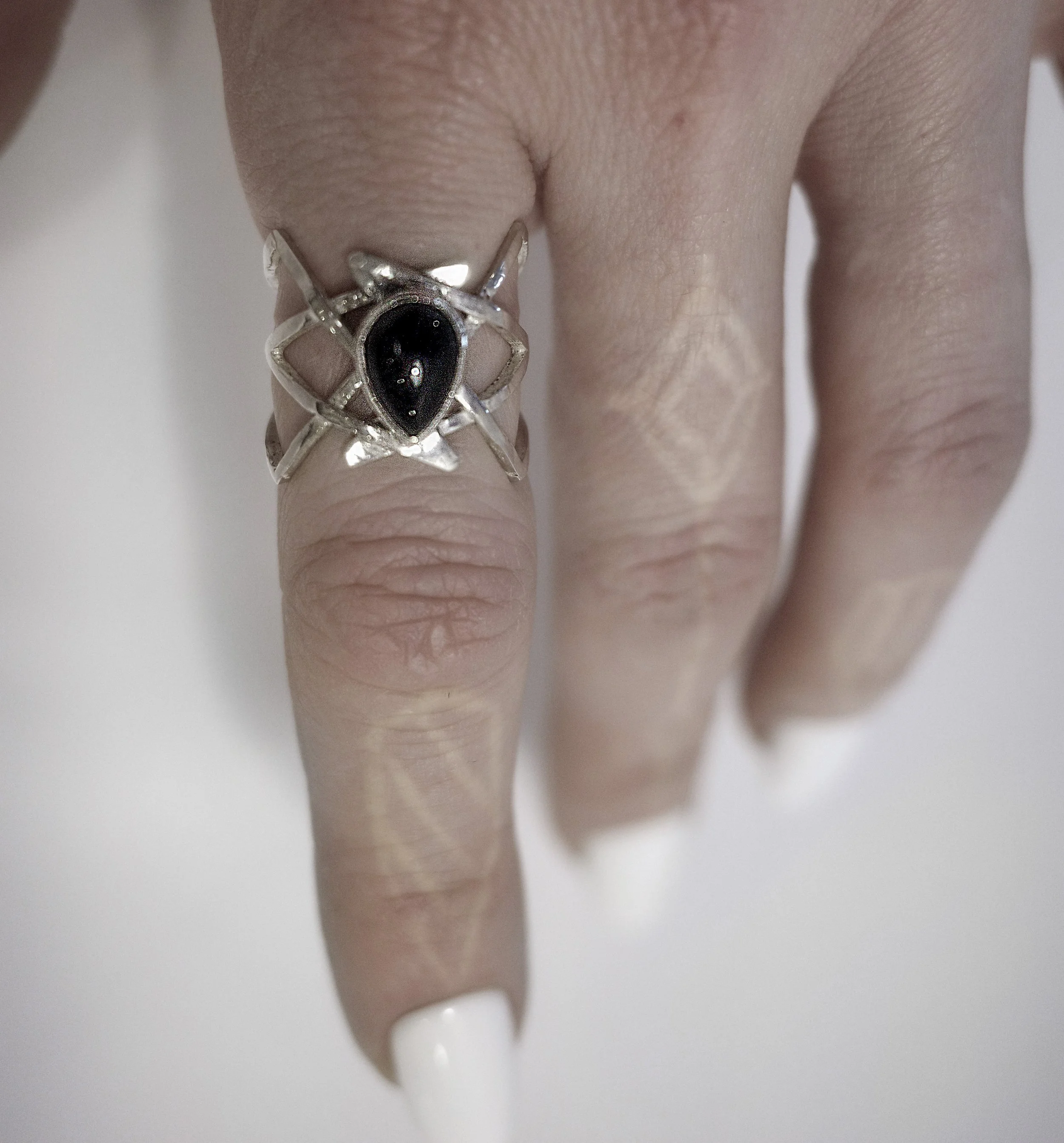teardrop onyx lattice ring worn.jpg