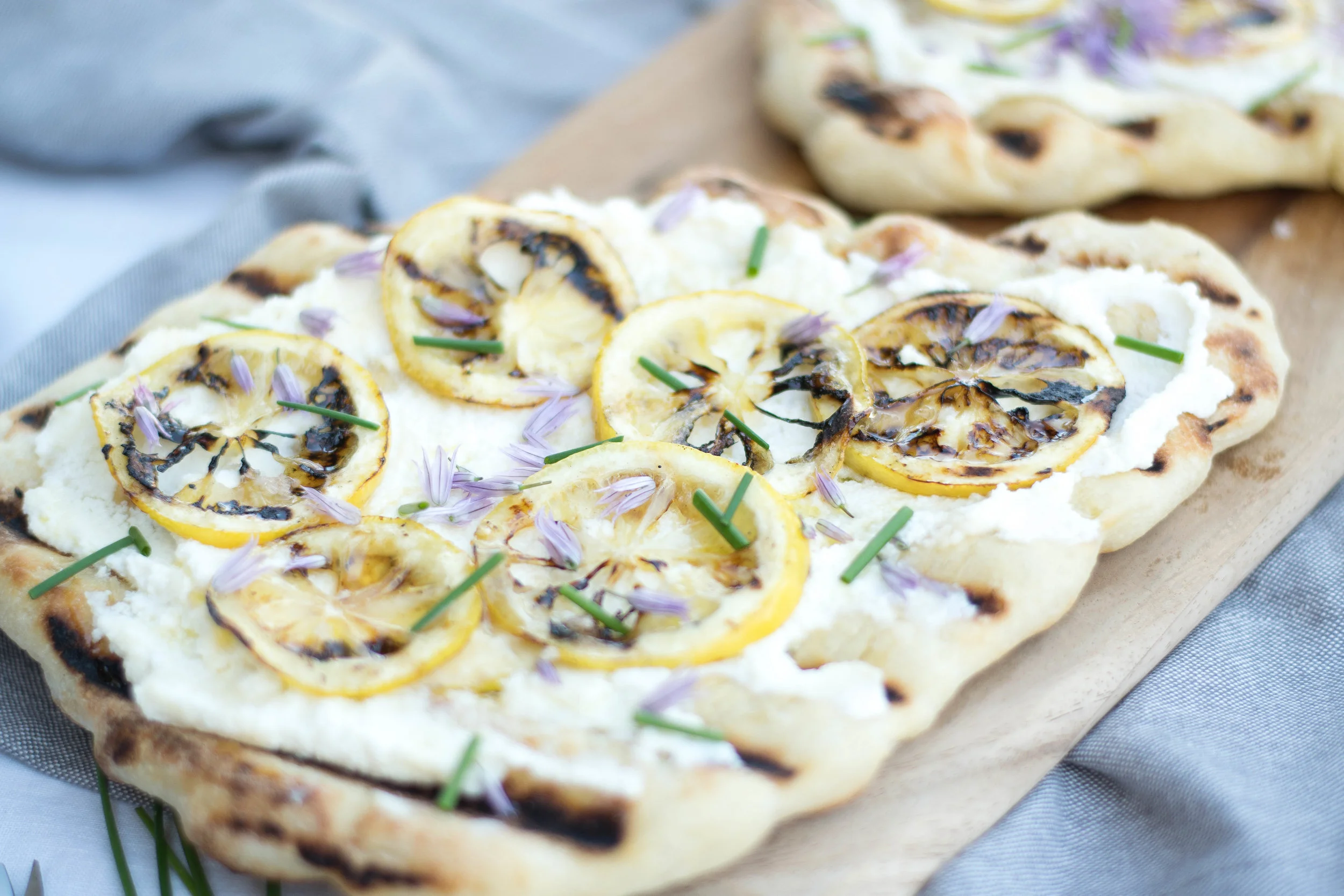 Grilled Flatbreads with Charred Lemon, Ricotta, + Chive Blossoms | All Purpose Flour Child
