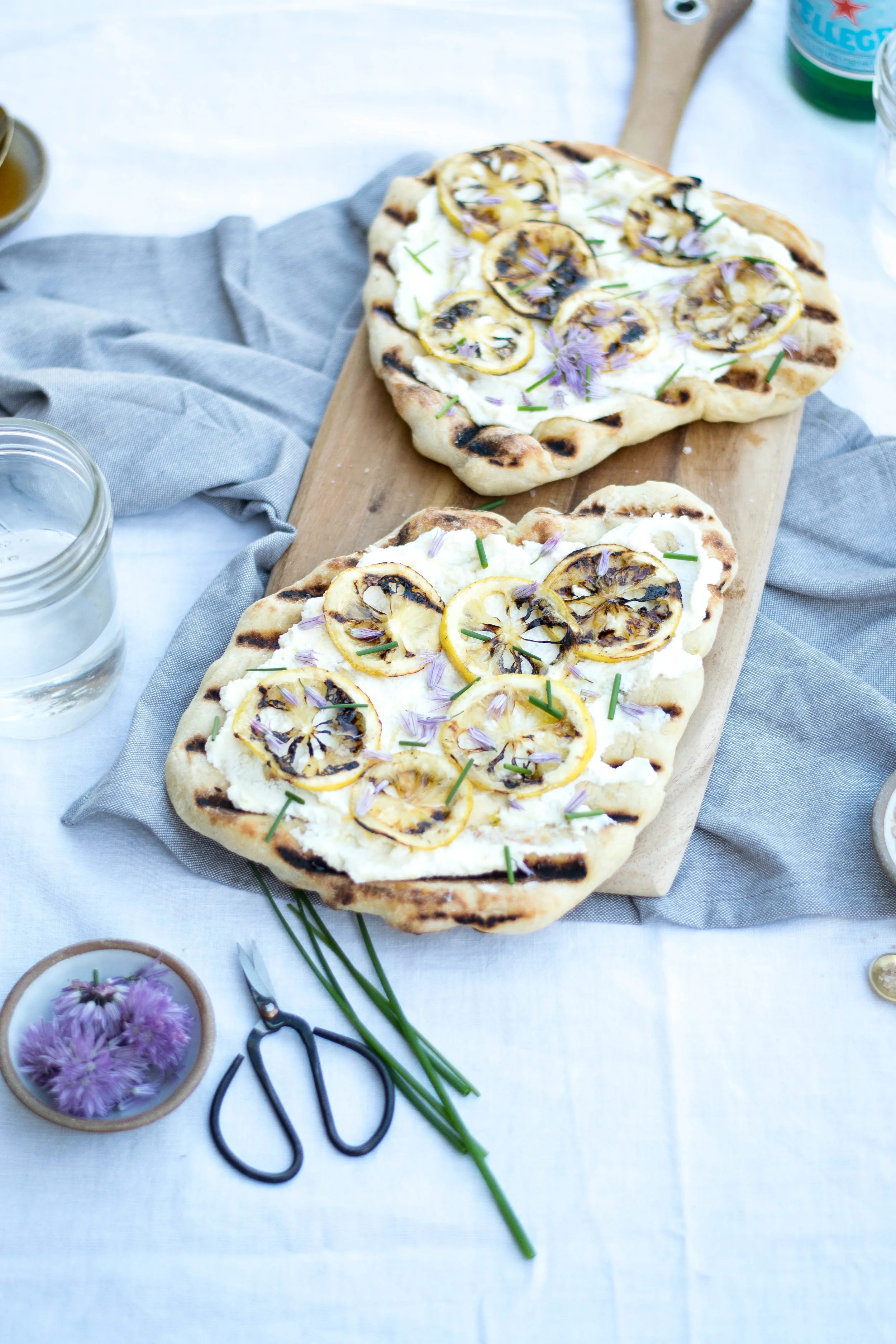 Grilled Flatbreads with Charred Lemon, Ricotta, + Chive Blossoms | All Purpose Flour Child