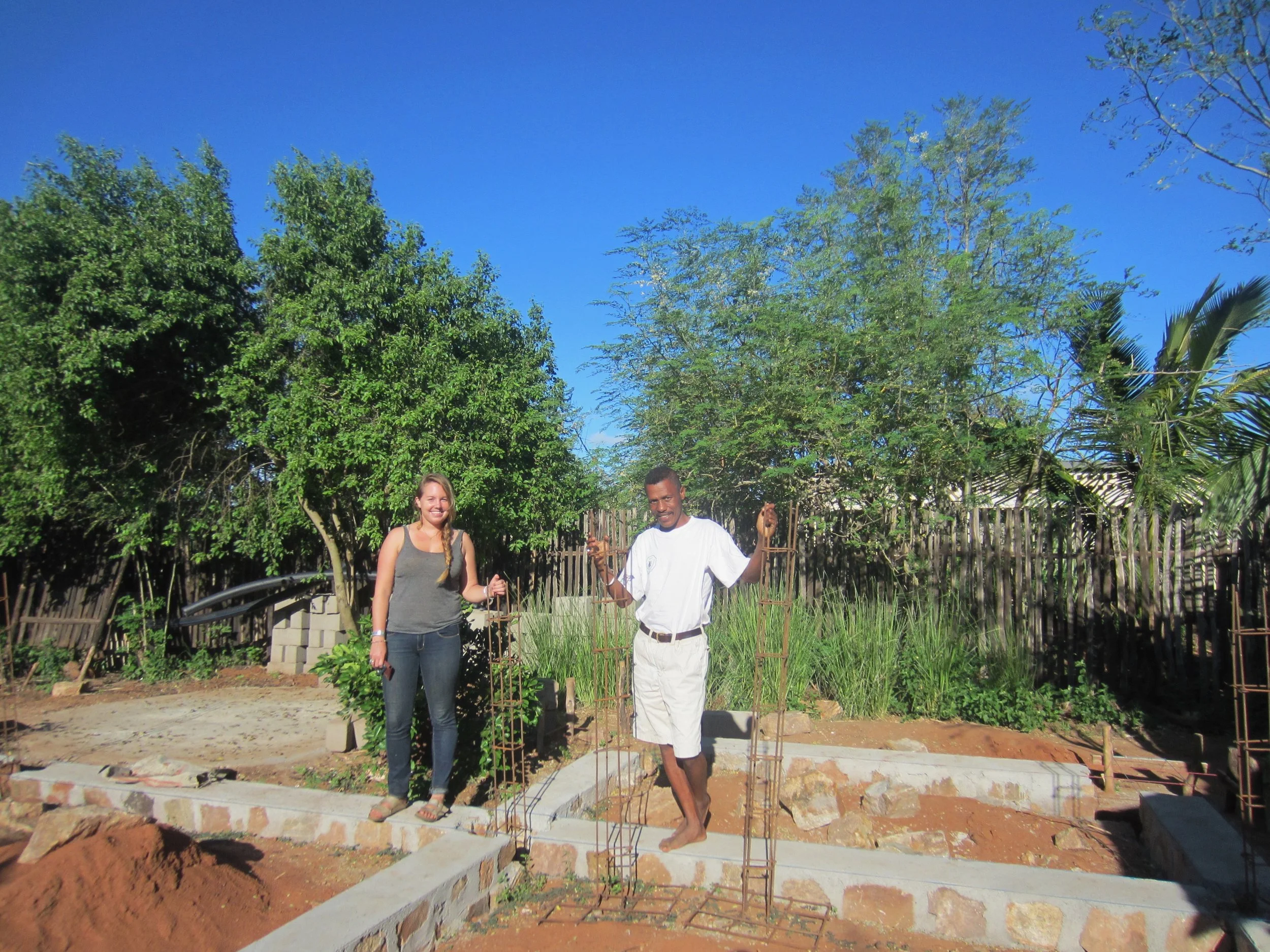 Josoah and I worked together with the community to build a community library. Here we are standing on its foundation back in May 2017. It is now complete and adults and children of all ages attend English club and read books inside. 