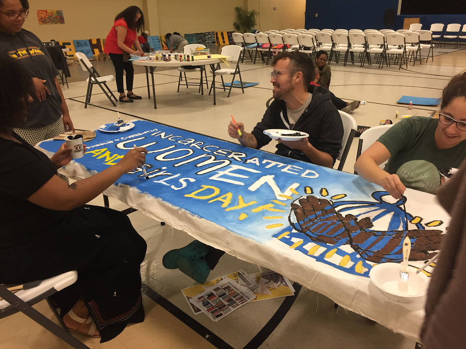 formerly-currently-incarcerated-women-girls-day-banner-painting.jpg