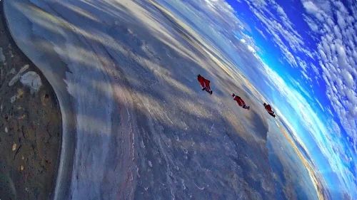 Glenn, Roger, Vicente and Ash (just out of frame) flying across Kati Thanda at Sumset.