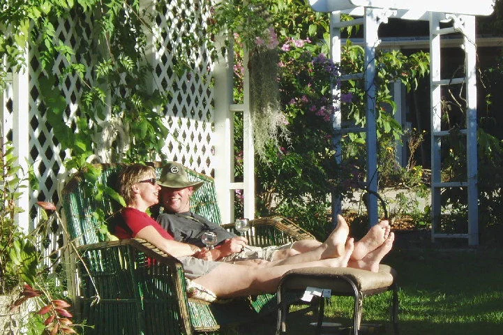 Guests enjoy the sun in the yard of the Hale Hookipa