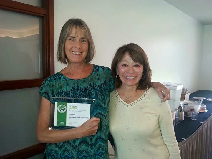 Cherie won the Better Homes and Gardens Real Estate Outstanding Sales Achievement 2014 — with Leslie Ann Yokouchi, owner of Better Homes and Gardens Real Estate Advantage Realty Valley Isle