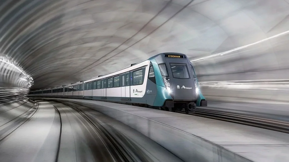 A modern subway train traveling through a tunnel.