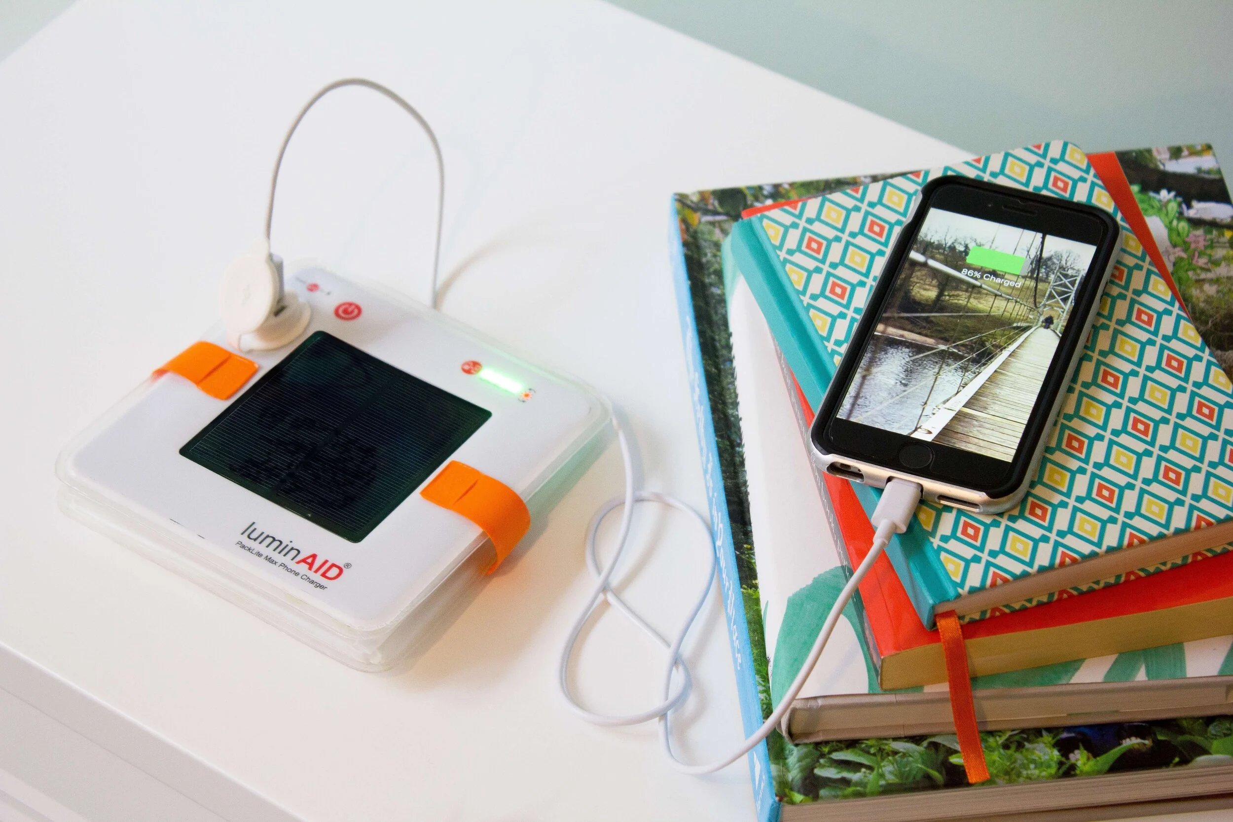 LuminAID-PackLite-Max-Phone-Charger-solar-inflatable-lantern-deflated-phone-book.jpg