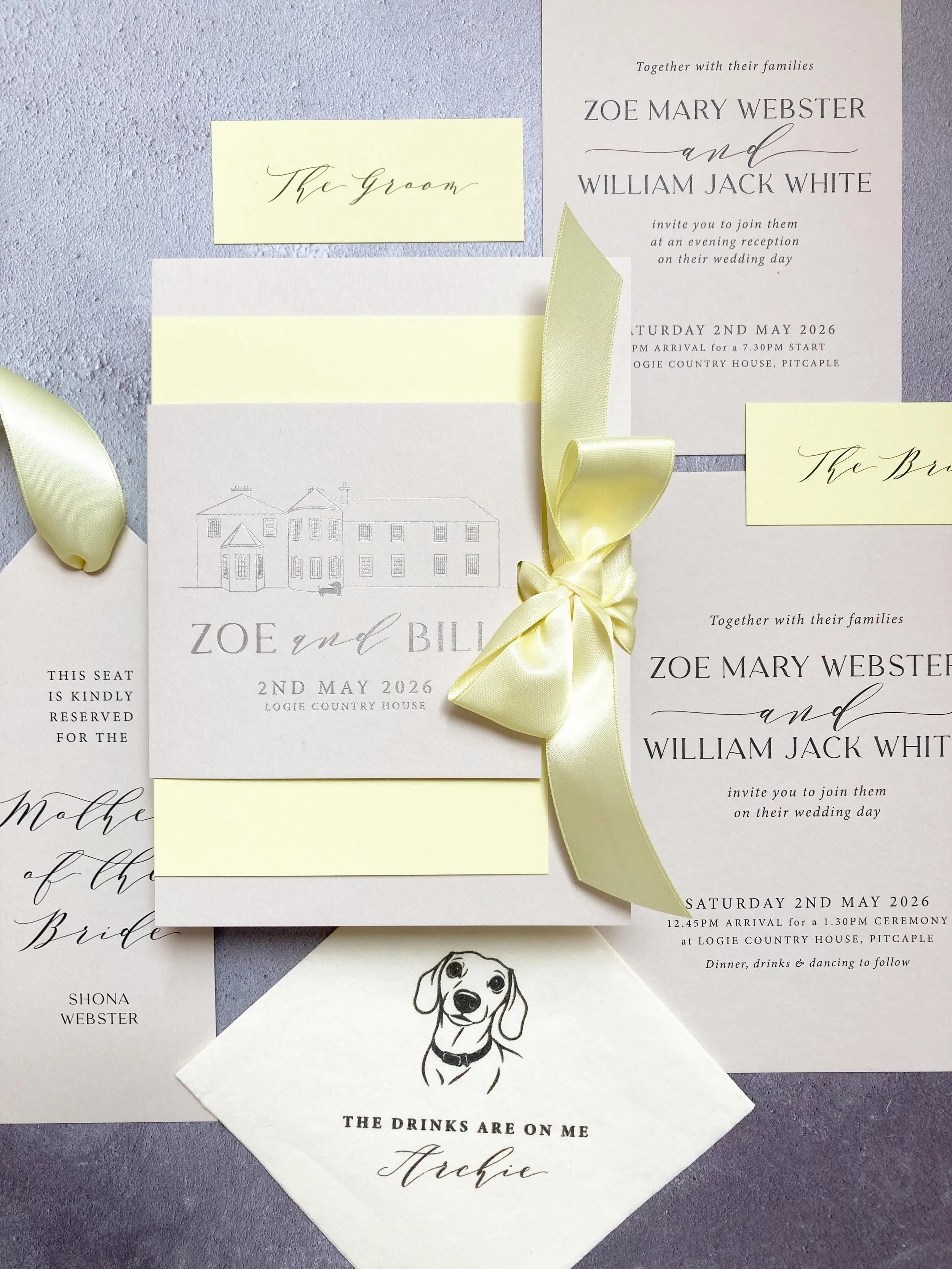 The prettiest colour combo of mist and sorbet yellow with a gunmetal hot foil venue drawing - and the cutest little cocktail napkins featuring Archie