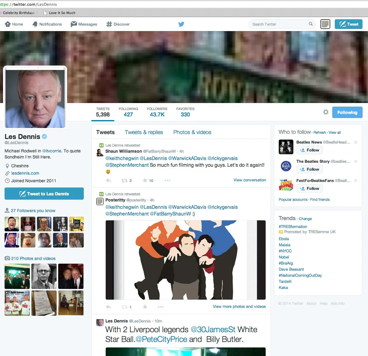 Screenshot of Les Dennis's Twitter profile page, displaying his profile picture, twitter stats, recent retweets, and a tweet with an illustration of four people standing close together, with one person in front, wearing darker clothes, and the others