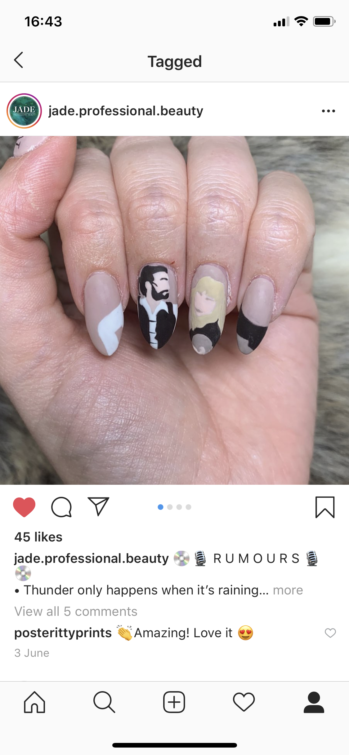 Close-up of a hand with five nails featuring different black and white and beige nail art designs, including a portrait of a man with a beard and long hair on the middle finger.