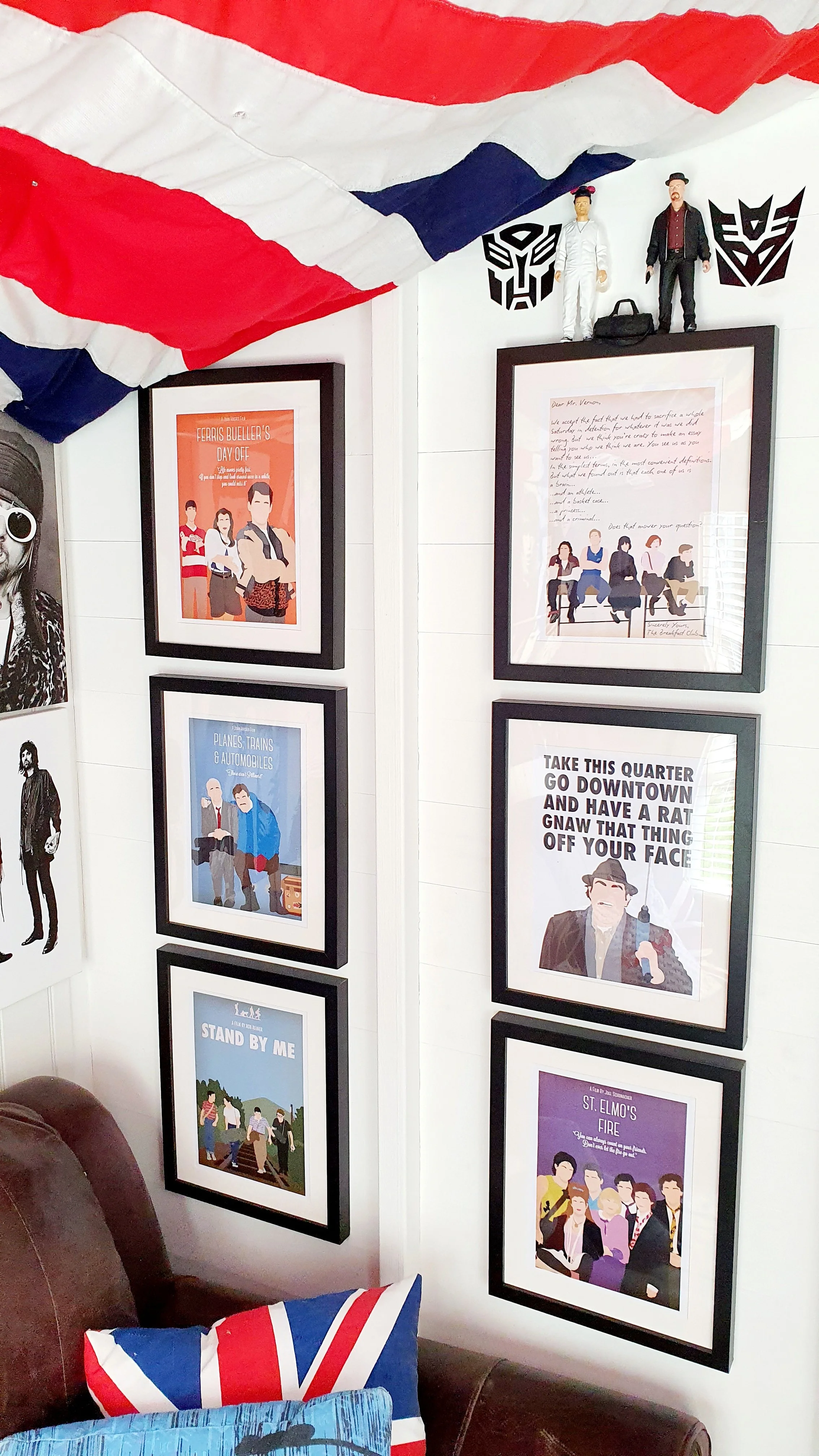 Decorated wall with framed posters, LEGO figures, and an American flag fabric draped overhead. The posters include illustrations of people and text messages.