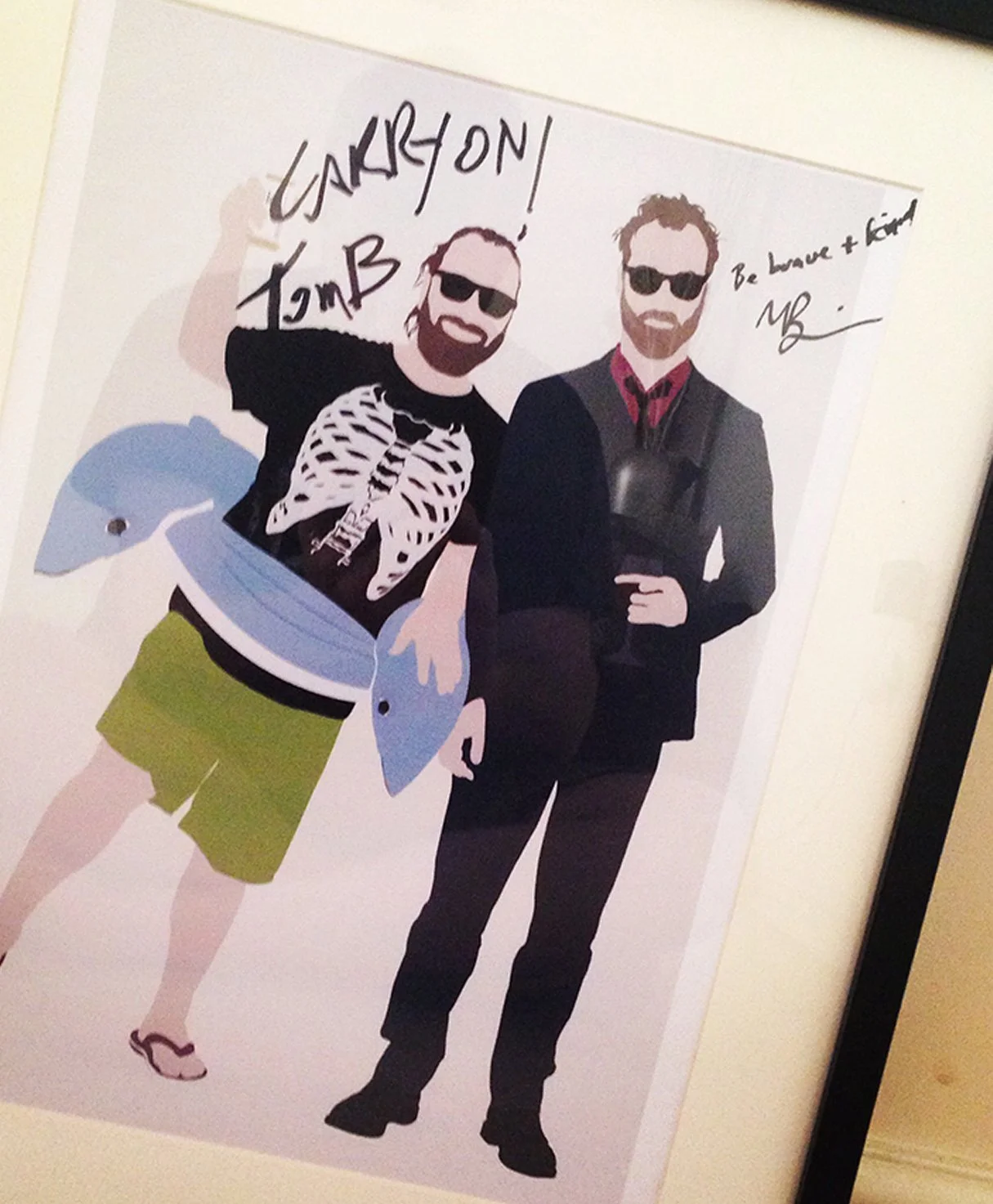 Illustration of two men wearing sunglasses, one dressed casually with a skeleton shirt and green shorts, the other in a suit with a briefcase, with handwritten notes that say "LARY ON TMB" and "Be brave + kind".