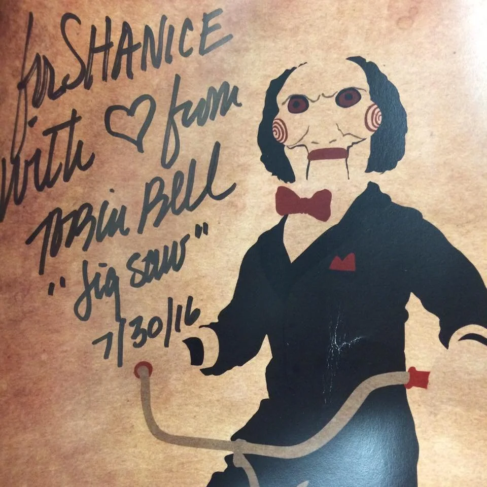 An illustration of a humanoid figure with a distorted, creepy face wearing a black suit, red bow tie, and a red pocket square, holding a cane. Handwritten text on the left side says, "DisHANCE with ♥ from Porta Bell 'jig saw' 7/30/16."