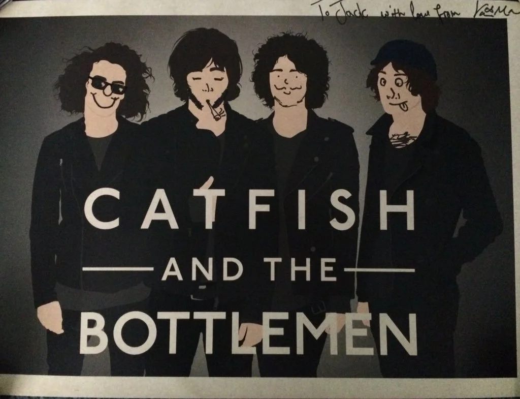 A stylized illustration of four men with curly hair, wearing black jackets, with text 'Catfish and the Bottlemmen' in front. Handwritten note in the top right corner says 'To Jack with love from Vasman'.