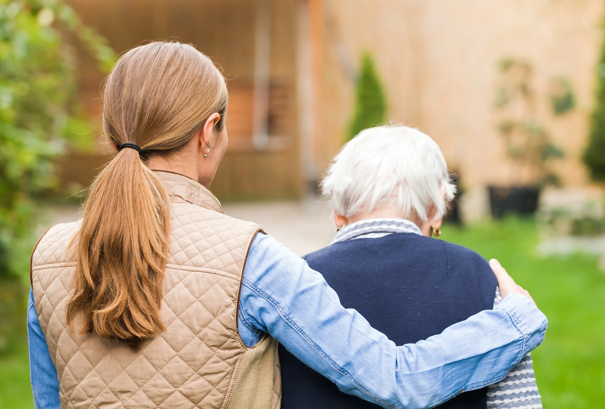 woman helping woman from back.jpg