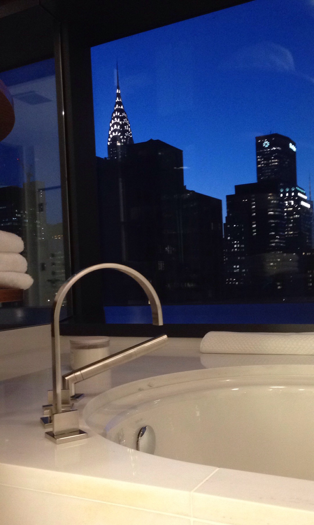 Enjoy your bath with the ultimate view of the Chrysler Building on the horizon