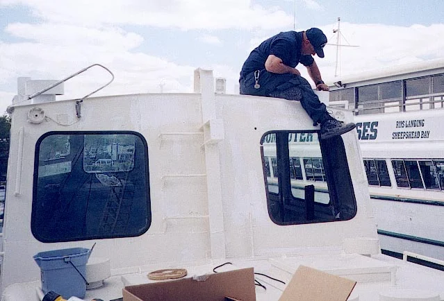 Wayne Pickhardt works on the wheelhouse