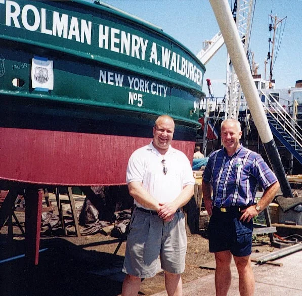 Henry Walburger Jr. and Greg Inspect The Lettering Job