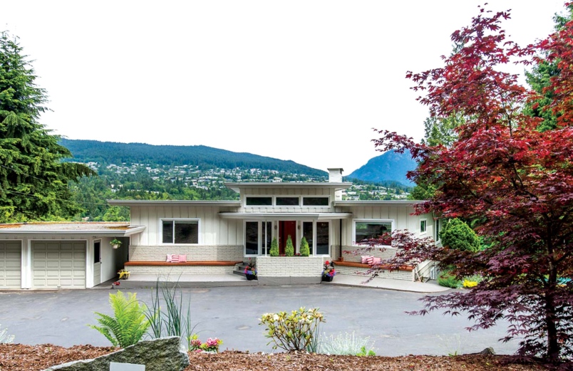 The exterior of this home designed by Henry A. Switzer looks rectangular outside but has rounded features inside.