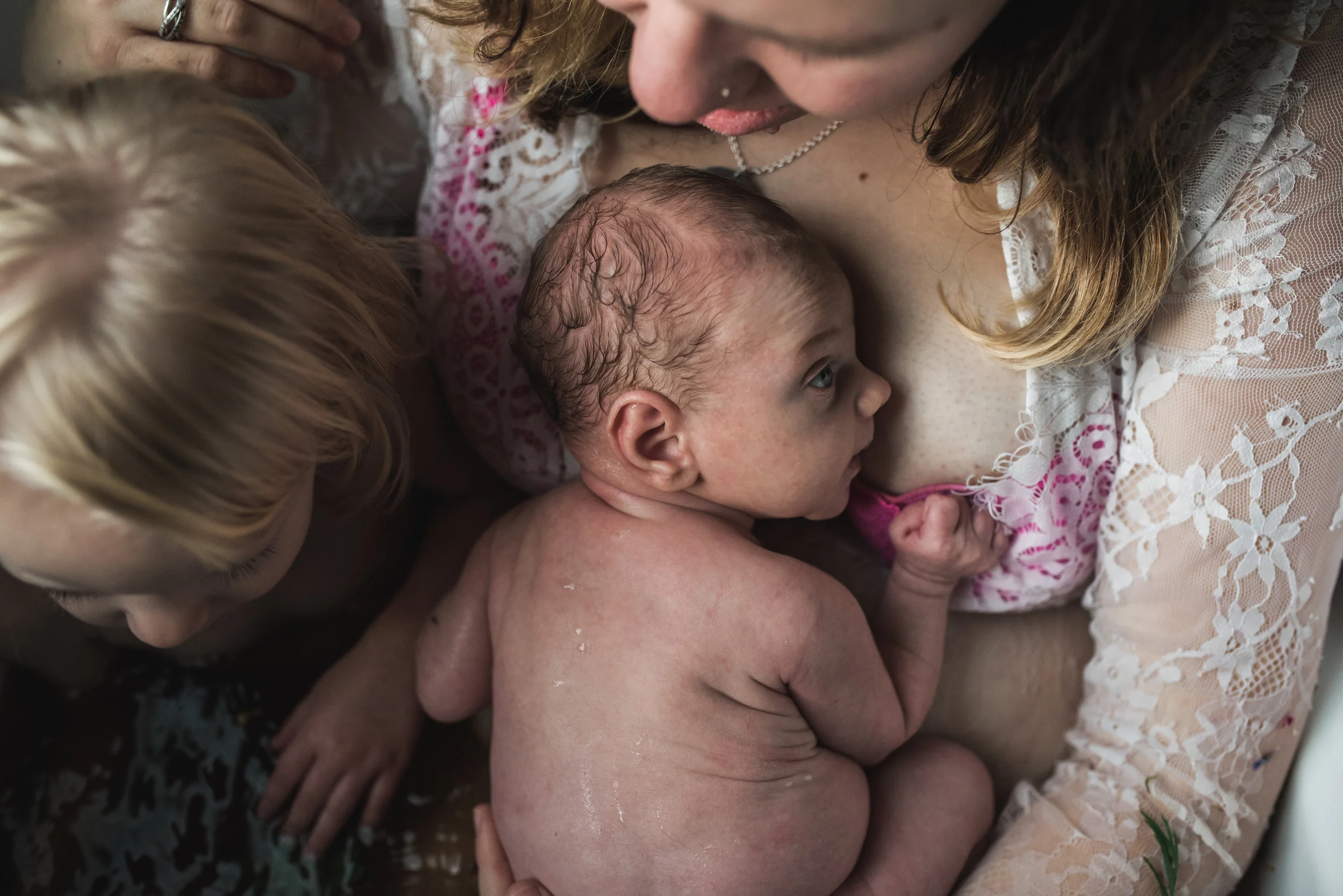 newborn herbal bath with sibling