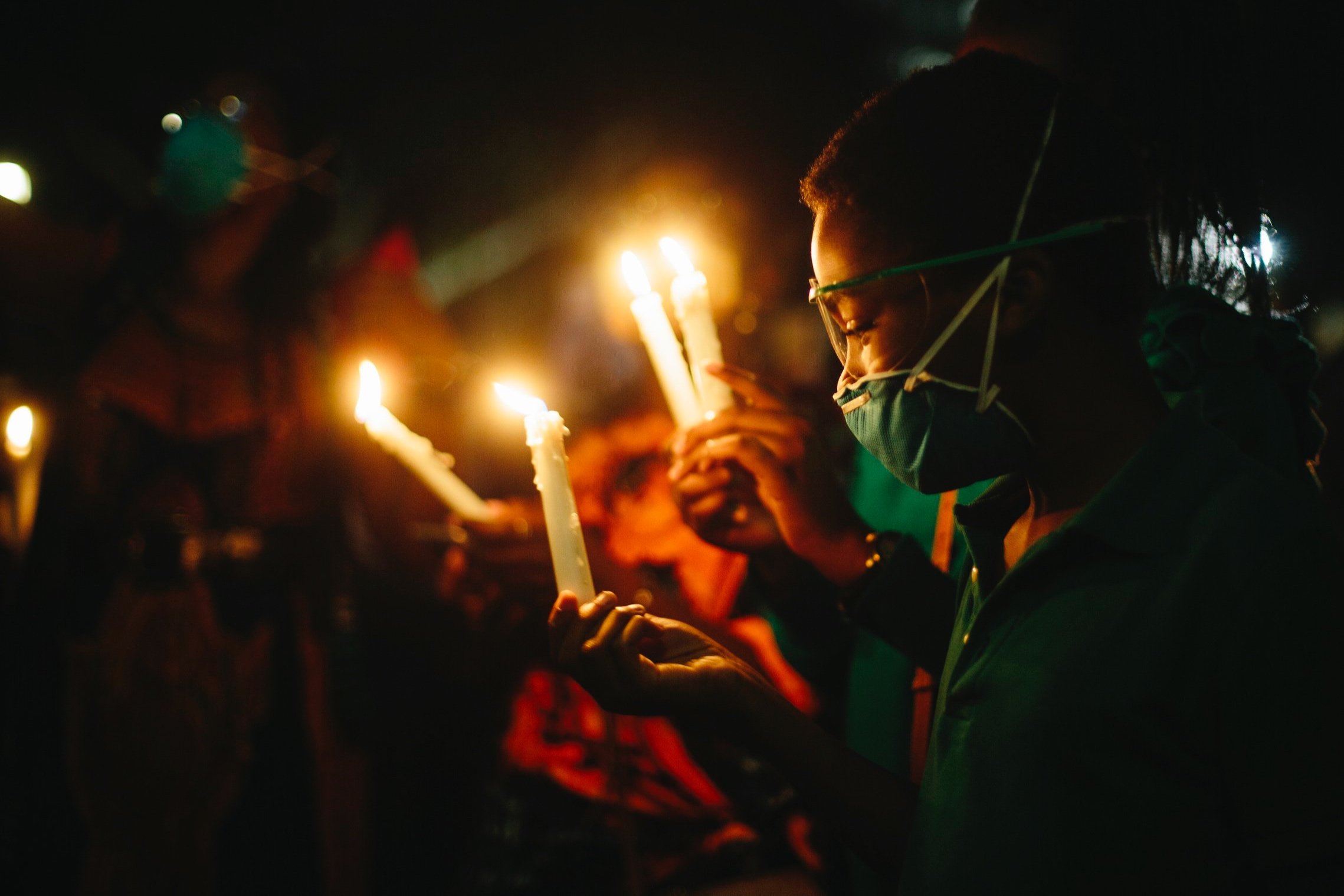  Children hold candles at a vigil to end the killings in Nigeria. 2020. Los Angeles, CA.  