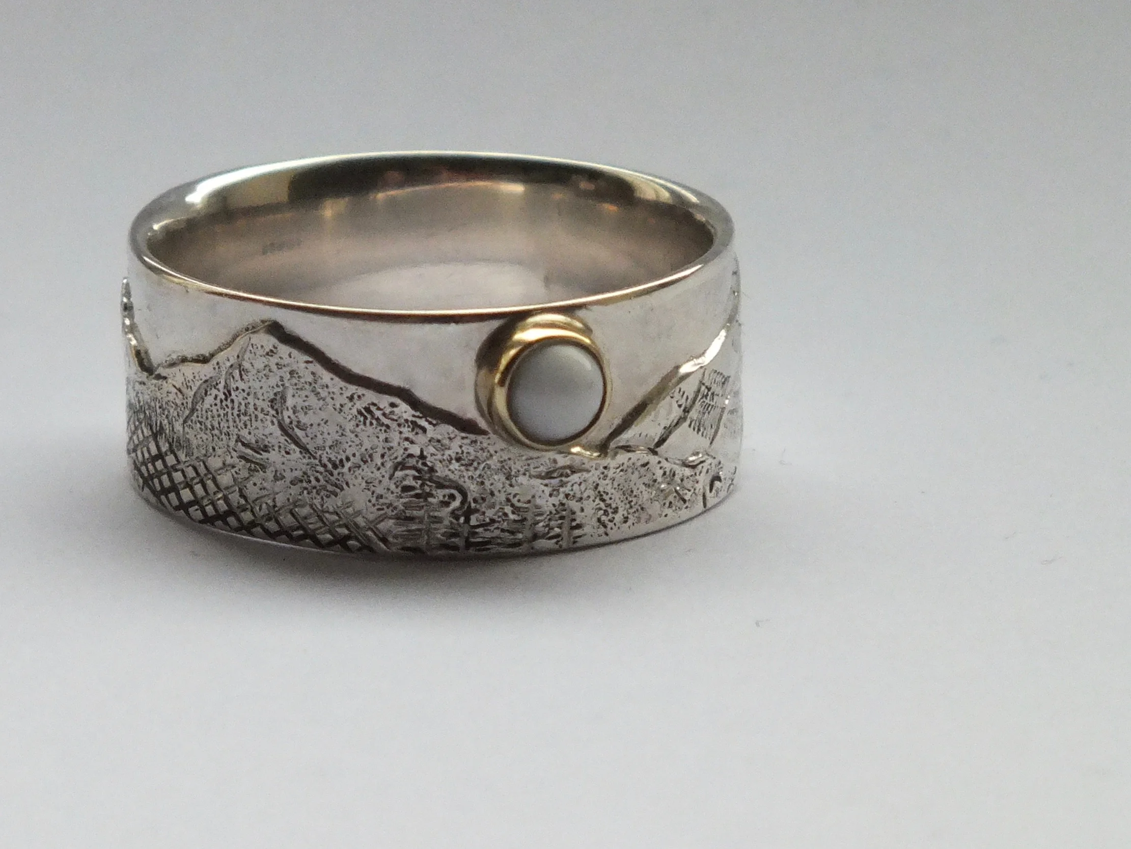 Chased and engraved ring of Oregon landscape with pearl, private commission