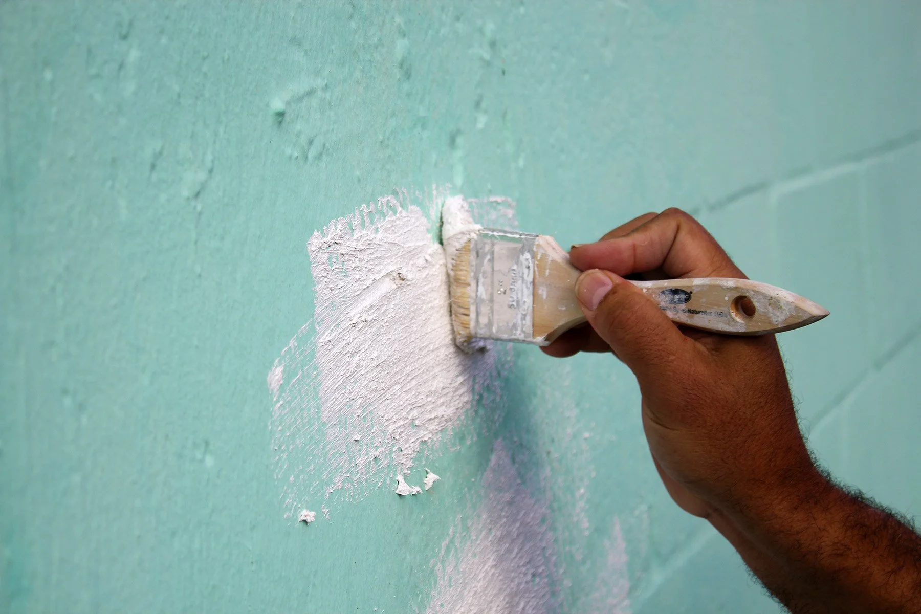Brush Grade Masonry Patch being Applied on the Wall.jpg