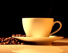 stock-footage-hot-cup-of-coffee-with-steam-on-a-wooden-table.jpg