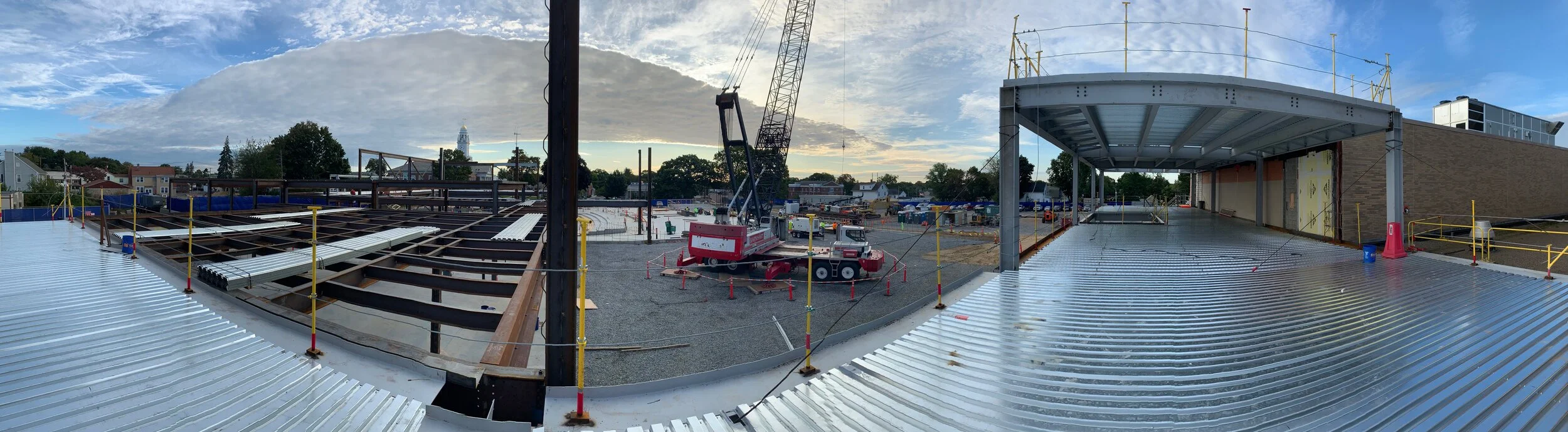 Structural steel and decking installation continues.