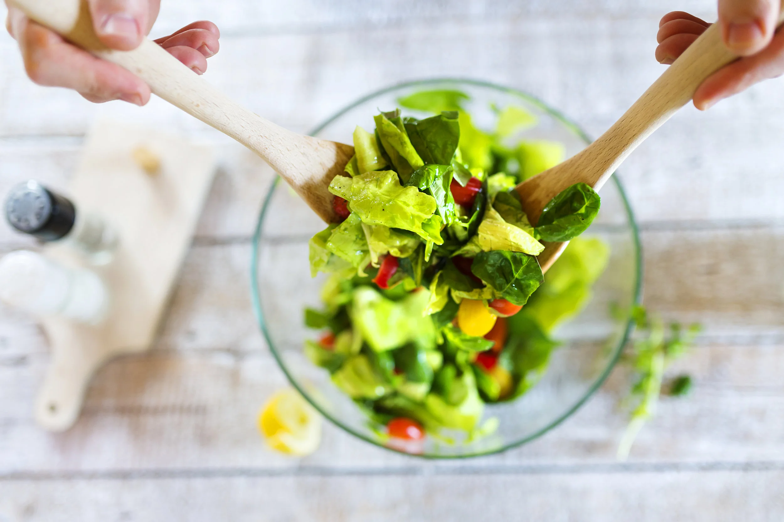 graphicstock-unrecognizable-young-man-in-the-kitchen-preparing-green-salad_H0eCuGsa-b.jpg