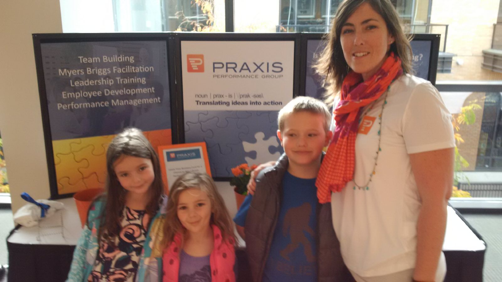 Stewart family representing the Praxis booth at the PowHertalks Nanaimo event