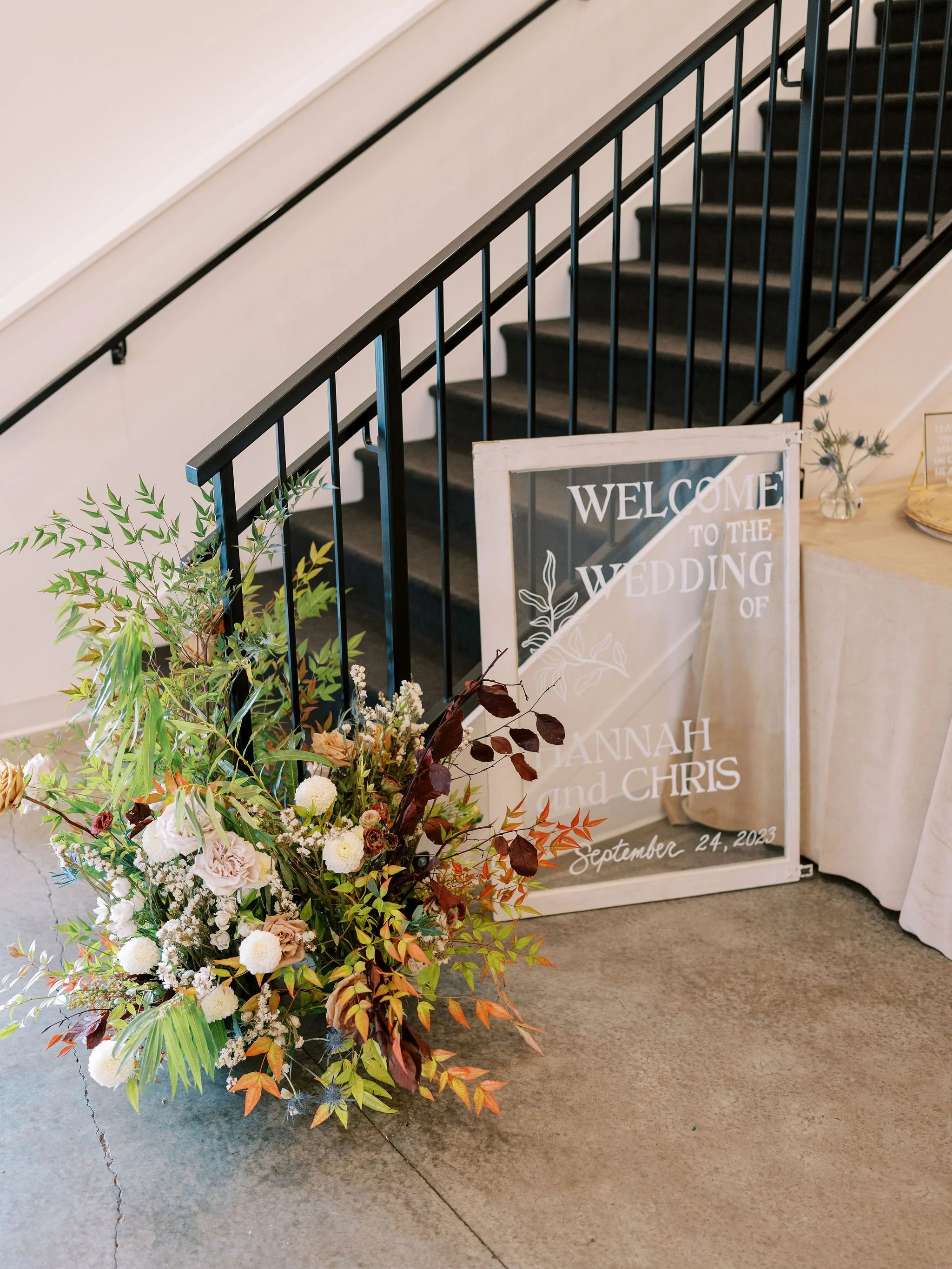 Wedding reception table with bud vase floral centerpieces designed by 1209 Creative at The Eloise in Madison Wisconsin, featuring modern editorial wedding florals