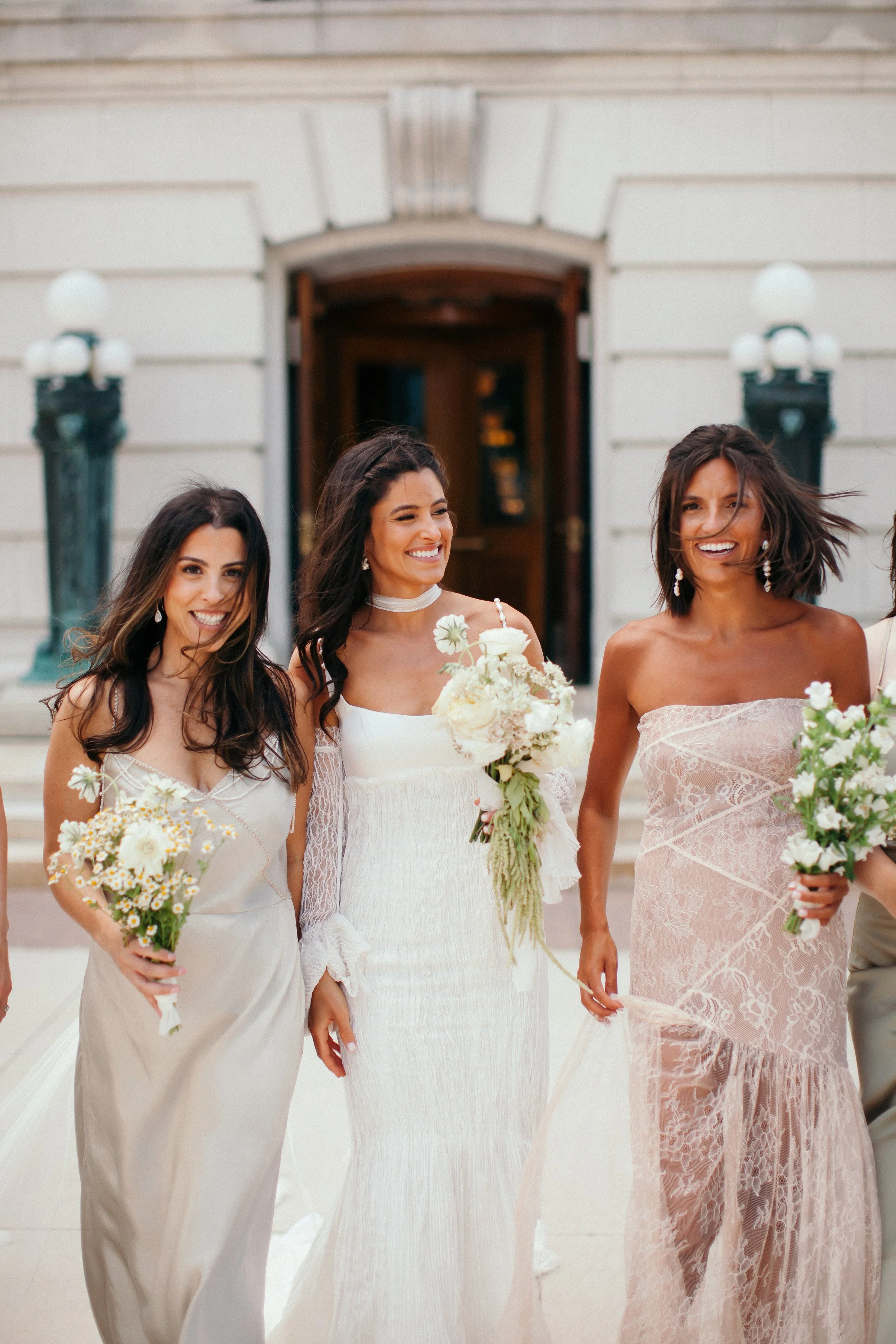 Bridal party with modern white wedding florals by a Madison WI wedding florist.