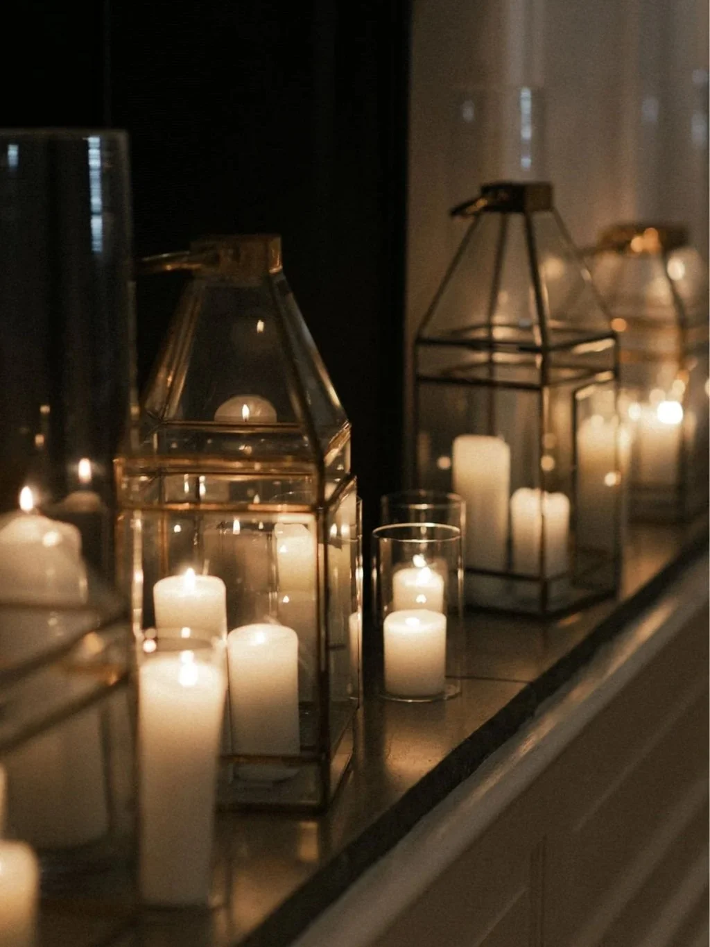 Candle and lantern styling detail designed by 1209 Creative for a Monroe Street Abbey wedding in Phoenix Arizona, featuring warm editorial wedding ambiance and moody lighting