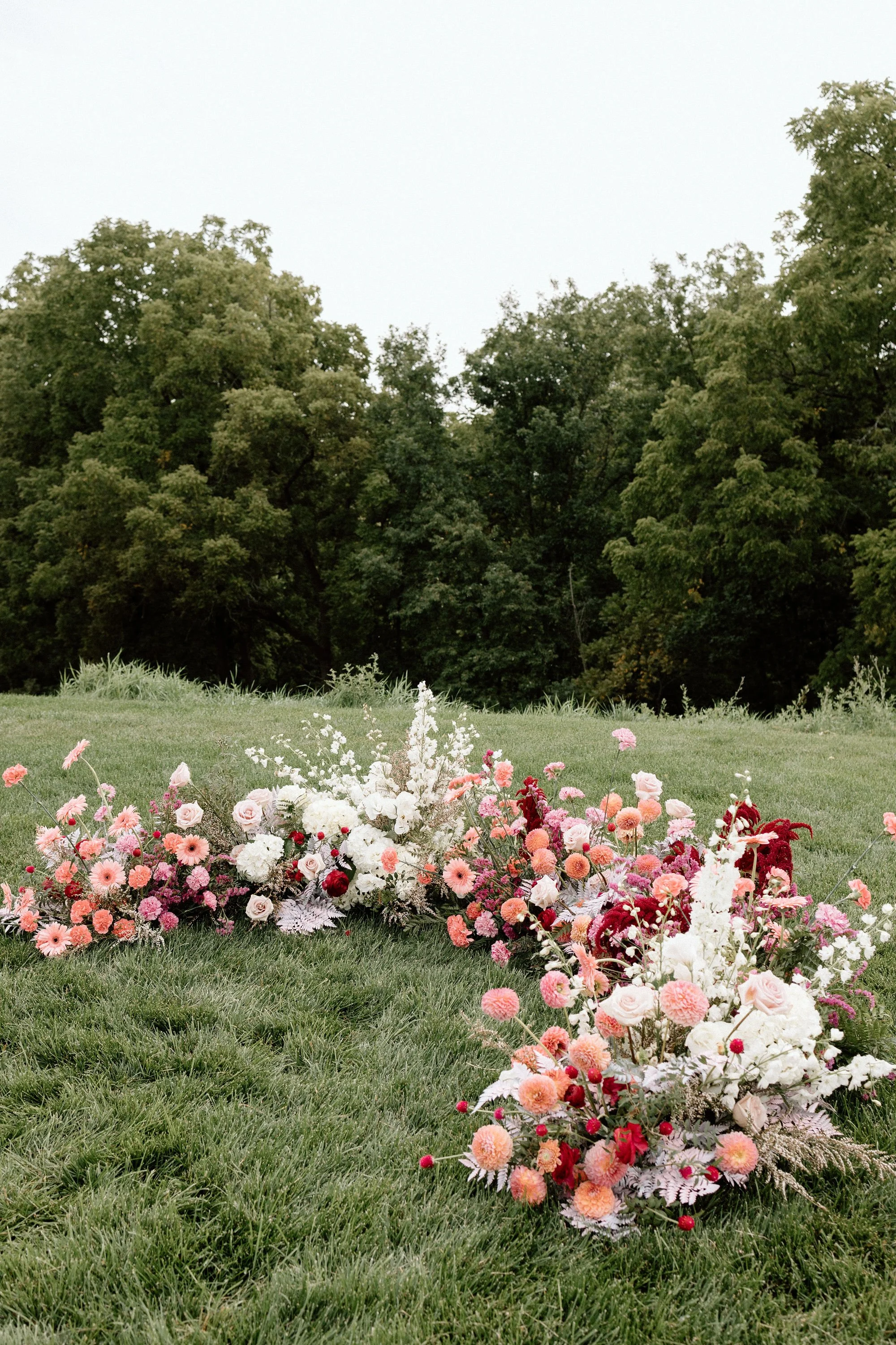 Garden style ground florals arranged for an outdoor wedding ceremony in Milwaukee Wisconsin, designed by 1209 Creative