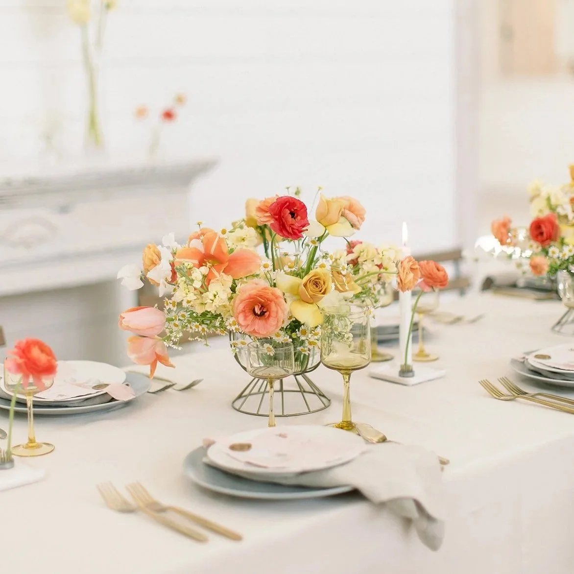 Wedding reception table with colorful floral centerpieces designed by 1209 Creative at Providence Vineyard in Hebron Illinois, featuring bright modern florals in a light filled vineyard venue