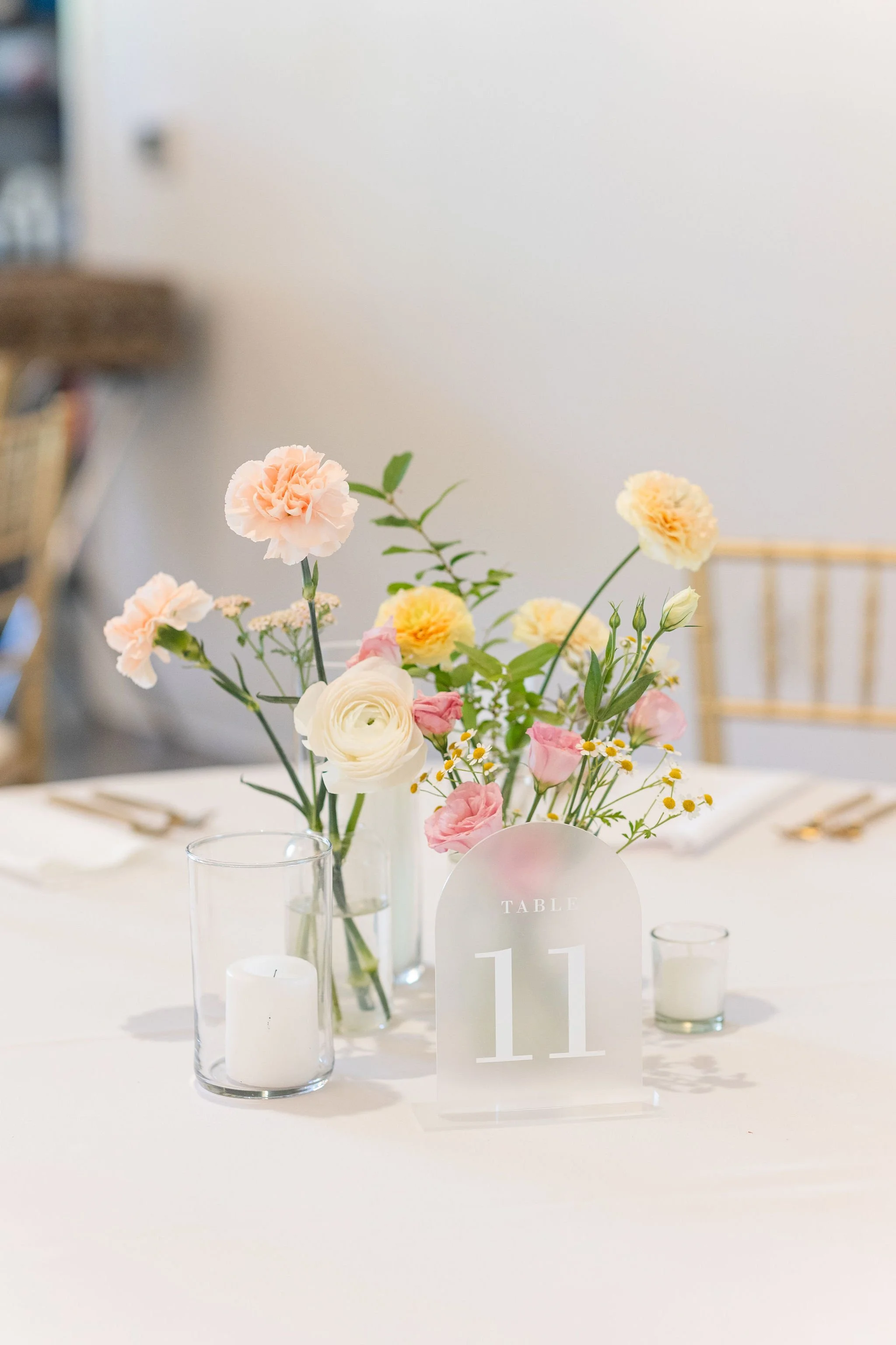 Bud vase floral centerpieces and table number designed by 1209 Creative for a wedding at The Eloise in Madison Wisconsin, styled with modern minimal wedding florals